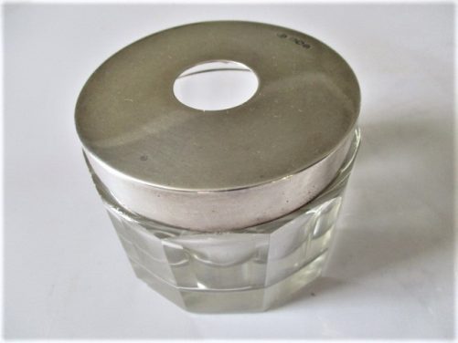 Hair tidy with silver lid