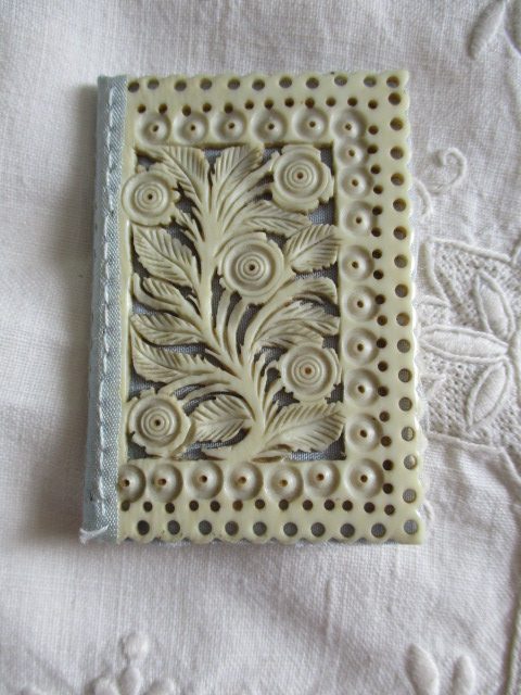 Ivory needle book, floral, pierced