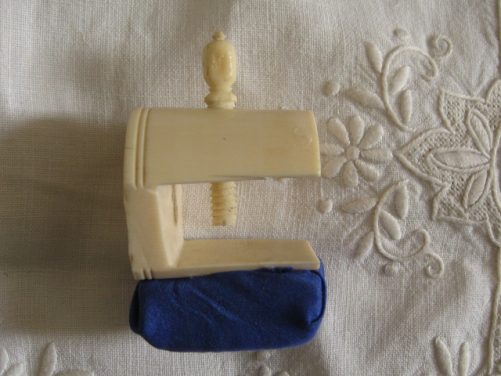 Antique ivory sewing clamp