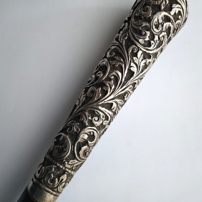 Walking cane with Indian silver handle.